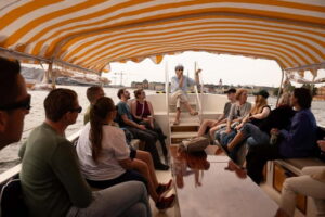 Stockholm: Guided City Sightseeing Open Electric Boat Tour - Where the blue boat boards at Skeppsbron 2